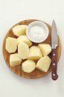 Peeled and cut potatoes — Stock Photo
