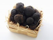 Black truffles in basket — Stock Photo