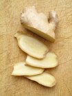 Partly sliced Fresh ginger root — Stock Photo