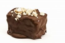Chocolate covered brownie with nuts — Stock Photo