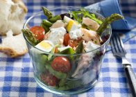 Salmon salad with asparagus, egg and tomatoes — Stock Photo