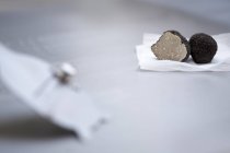 Black halved truffles — Stock Photo