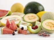 Melon with feta and salami — Stock Photo