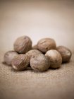 Heap of whole Nutmegs — Stock Photo
