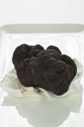 Perigord truffle on paper — Stock Photo