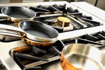Closeup view of various pots on a gas cooker — Stock Photo