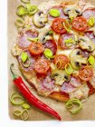 Pizza with salami, mushrooms, tomatoes — Stock Photo