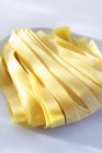 Raw ribbon pasta — Stock Photo
