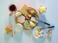 Cheese platter with baguette — Stock Photo