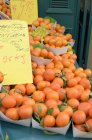 Fresh tangerines at street market — Stock Photo