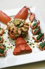 Lobster dish with artichoke — Stock Photo