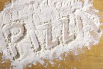 Word written in flour — Stock Photo