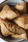 Closeup top view of vegetable Samosas in a metal bowl — Stock Photo