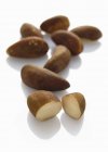Pile of Brazil nuts on white — Stock Photo