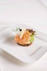 Canape with smoked salmon — Stock Photo