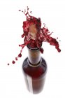 Red wine spraying out — Stock Photo