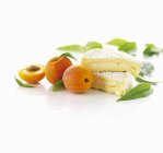 Brie cheese and fresh ripe apricots — Stock Photo