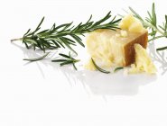 Parmesan cheese and rosemary — Stock Photo
