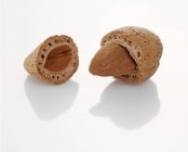 Raw cracked almond — Stock Photo