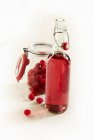 Bottle of raspberry liqueur — Stock Photo