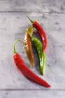Quatro pimentas frescas — Fotografia de Stock