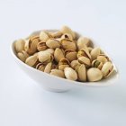Bowl of toasted pistachios — Stock Photo