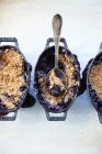 Top view of three mixed berry crumbles with spoon — Stock Photo