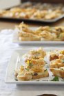 Closeup view of canapes with fish on platters — Stock Photo
