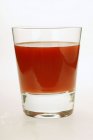 Tomato juice in glass — Stock Photo