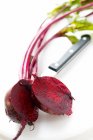 Beetroot with leaves halved — Stock Photo