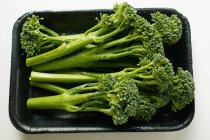 Broccoli in black plastic container — Stock Photo