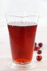 Cranberry juice in glass — Stock Photo