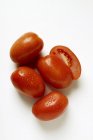 Plum tomatoes with drops of water — Stock Photo