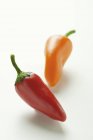 Red and orange Chili peppers — Stock Photo
