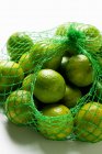 Key limes in net — Stock Photo