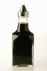 Closeup view of soy sauce in small bottle — Stock Photo