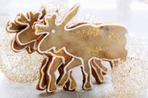 Biscuits over christmas decorations — Stock Photo