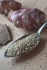 Quinoa seeds and Jerusalem artichokes — Stock Photo