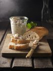 Homemade lard on baguette bread and in a glass — Stock Photo