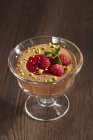 Closeup view of Mousse au chocolat with raspberries in glass — Stock Photo