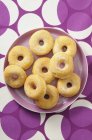 Sugared doughnuts on plate — Stock Photo