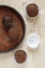 Top view of chocolate and nut truffles with chocolate sprinkles — Stock Photo