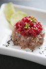 Closeup view of tuna fish tatar with red fruit salsa — Stock Photo