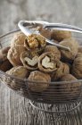 Walnuts in wire basket — Stock Photo