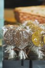 Closeup view of chocolate lollies wrapped in cellophane — Stock Photo