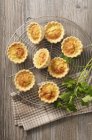 Top view of Spicy mini Quiche on a cooling rack — Stock Photo
