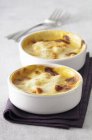 Closeup view of crustacean Gratin in two white bowls — Stock Photo
