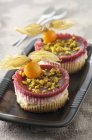 Mini cheesecakes with red fruits — Stock Photo