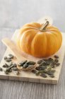 Fresh mini pumpkin with seeds — Stock Photo