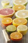 Assorted halved citrus fruits — Stock Photo